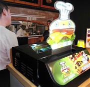 カシオ計算機の店頭向け電子看板「カシオサイネージ」＝２６日、東京都港区