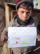 「病院と救急車が欲しい」と訴える１３歳のマスード君＝２０１４年２月１１日、アフガニスタン・ヘラート州（ワールド・ビジョン・ジャパン撮影）