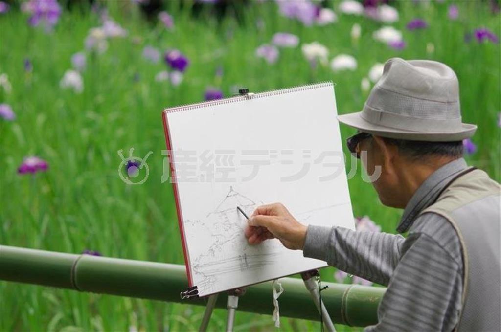 絵を描く人の後ろ姿とキャンバス、その奥にショウブが美しくボケていて、キャンバスに目がいきますね。余計なモノが入っていなくて、被写体を少し右に寄せて、竹を斜めに入れている構図がとてもバランスが良く、見る人も落ち着いて鑑賞することができます＝２０１５年、東京都渋谷区（林浩治さん撮影）