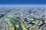 空から見た武蔵小杉周辺。多摩川の西側（右側）が川崎市中原区、東側は東京都大田区だ