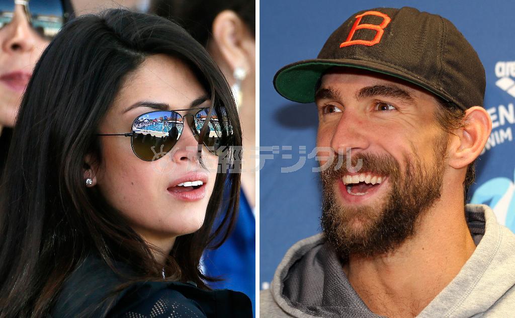 米国のマイケル・フェルプス選手（右）と婚約者で元ミス・カリフォルニアのニコル・ジョンソンさん（ＡＰ）