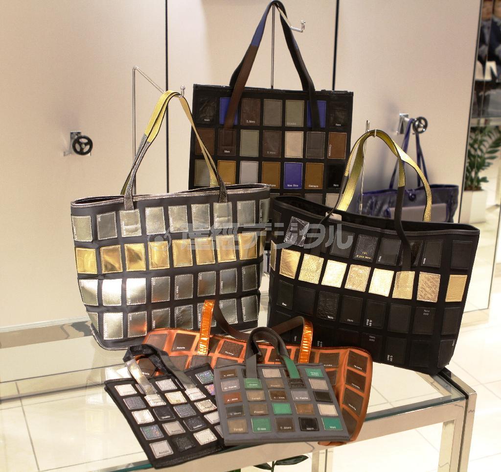 革のサンプルを同じ形に切り取って合わせたもの。ところどころに入っている文字は、色の名や色番号。初めから書かれていたものと、バッグにするにあたって書いたものとが混在している（４万１０４０円～６万９１２０円）＝２０１５年１０月２２日、神奈川県横浜市西区の横浜高島屋（田中幸美撮影）