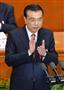 開幕した全人代で政府活動報告を終えて拍手する中国の李克強首相＝５日、北京の人民大会堂（共同）
