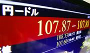 １ドル＝１０７円台をつけた円相場を示すモニター＝１１日午前、東京・東新橋