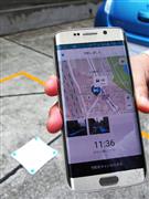 スマートフォンで事前予約や駐車後の料金の引き落としなども可能になるＮＴＴドコモの「スマートパーキングシステム」＝７日、東京都渋谷区（大坪玲央撮影）