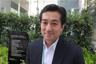 「大学などの研究者の出願意識を変える必要がある」と語るＡＭＥＤ知的財産部長の天野斉氏＝東京・大手町