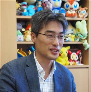 インタビューに答える株式会社ポケモンの専務執行役員、宇都宮崇人氏（高橋寛次撮影）