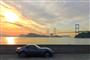 瀬戸内の夕日としまなみ海道の来島海峡大橋を背に、横顔を浮かび上がらせるロードスターＲＦ（ｉＰｈｏｎｅで撮影）