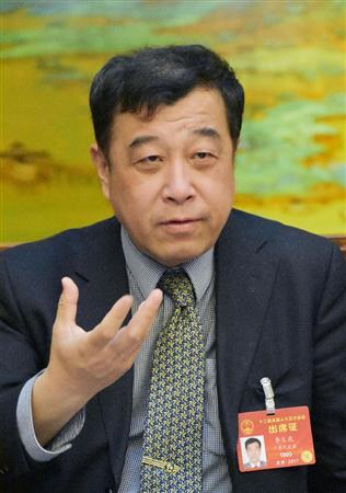 インタビューに応じる北京大台湾研究院の李義虎院長（共同）