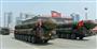 北朝鮮の労働新聞が１６日掲載した、軍事パレードに登場した新型ＩＣＢＭ用の可能性がある片側８輪の発射管付き車両の写真（共同）
