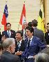 ＴＰＰ協定発効記念式典で各国の関係者と談笑する安倍晋三首相（中央右）と茂木敏充経済再生担当相（同左）＝１９日午後、首相官邸（桐山弘太撮影）