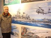 原画展の会場に立つ画家、高荷義之さん＝前橋市千代田町の前橋文学館