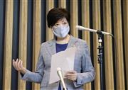 西村経済再生相と会談後、取材に応じる東京都の小池百合子知事＝１４日午後、東京都千代田区