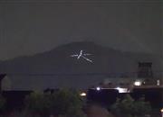 ライトアップされた大文字＝８日午後１１時ごろ、京都市左京区（野村雅夫さん提供）