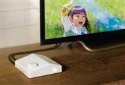 「まごチャンネル　ｗｉｔｈ　ＳＥＣＯＭ」の本体装置。家の形のデザインで、窓の部分が光ることで受信を知らせる。月額利用料金は１６８０円。本体価格３万円（いずれも税別）