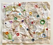 地図に穴をあけて刺繍を施した作品